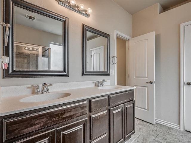2313 NW 154th St, Edmond, OK 73013 - bathroom featuring double vanity and tile patterned flooring