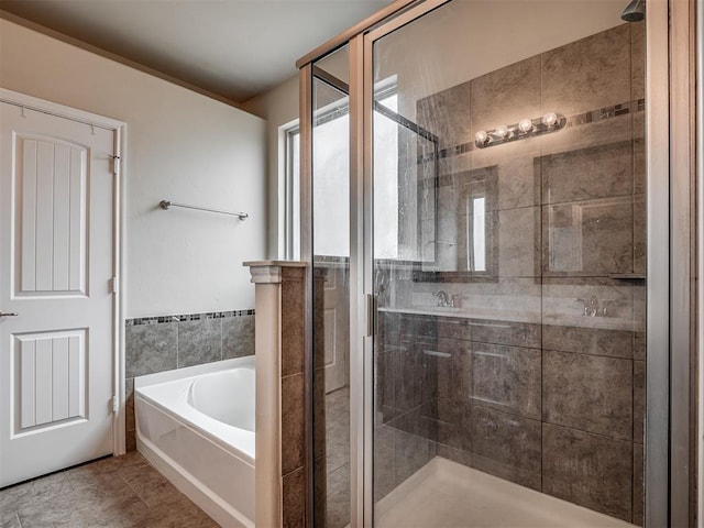 2313 NW 154th St, Edmond, OK 73013 - bathroom featuring a garden tub, a shower stall, and plenty of natural light