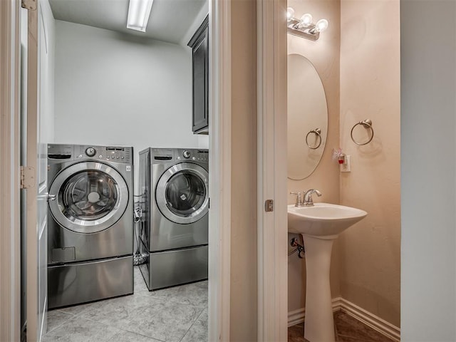 2313 NW 154th St, Edmond, OK 73013 - laundry area with washing machine and clothes dryer and tile patterned flooring