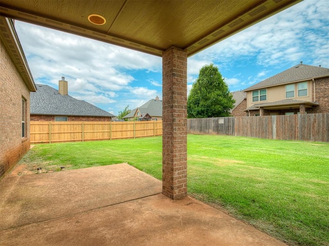 2313 NW 154th St, Edmond, OK 73013 - fenced backyard with a patio