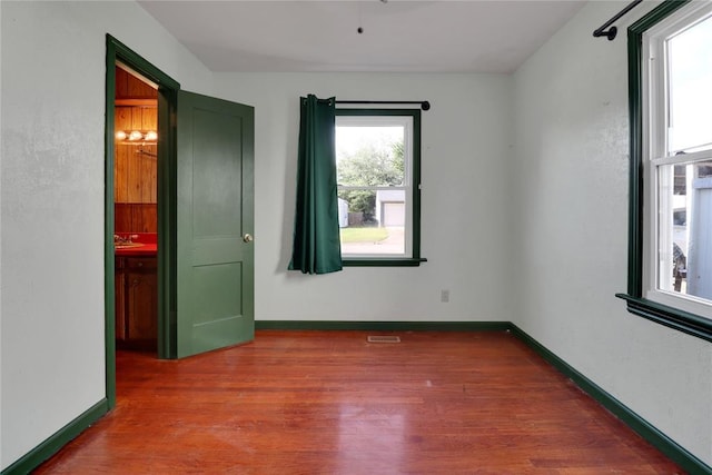 4012 SE 25th St, Del City, OK 73115 - unfurnished bedroom with wood finished floors and baseboards