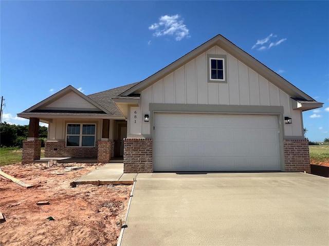 681 Cedar Hill Way, Washington, OK 73093 - view of front facade featuring brick siding, board and batten siding, and concrete driveway