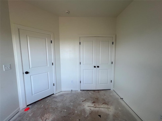 681 Cedar Hill Way, Washington, OK 73093 - unfurnished bedroom featuring concrete flooring and a closet
