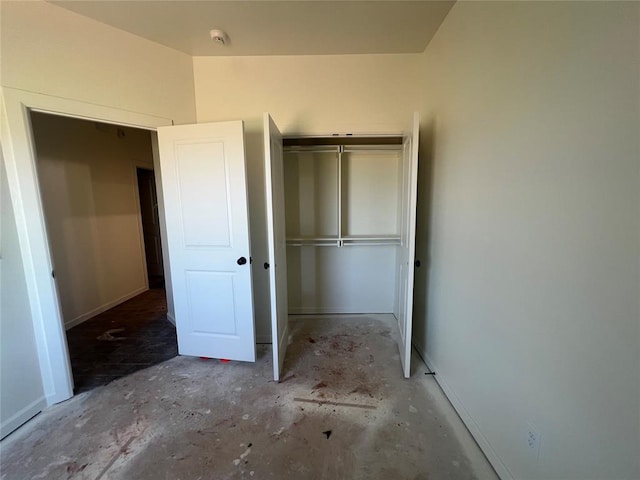 681 Cedar Hill Way, Washington, OK 73093 - unfurnished bedroom with a closet and unfinished concrete flooring