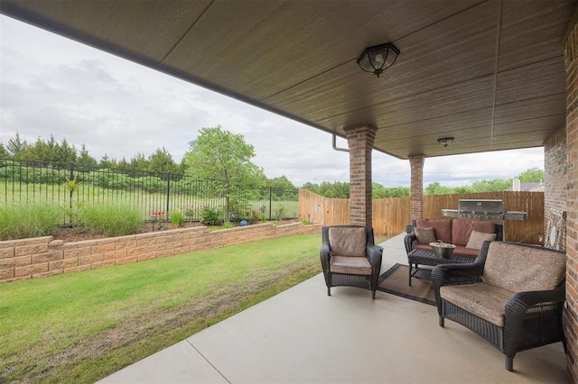 6301 Oxnard St, Edmond, OK 73034 - fenced backyard with a patio area, an outdoor kitchen, and an outdoor living space