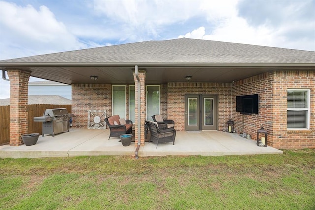6301 Oxnard St, Edmond, OK 73034 - back of property with brick siding, a shingled roof, and a patio