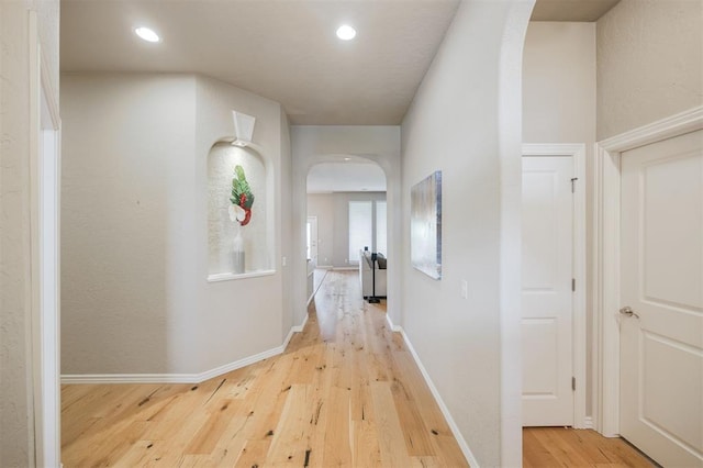 6301 Oxnard St, Edmond, OK 73034 - corridor with arched walkways, wood finished floors, and recessed lighting