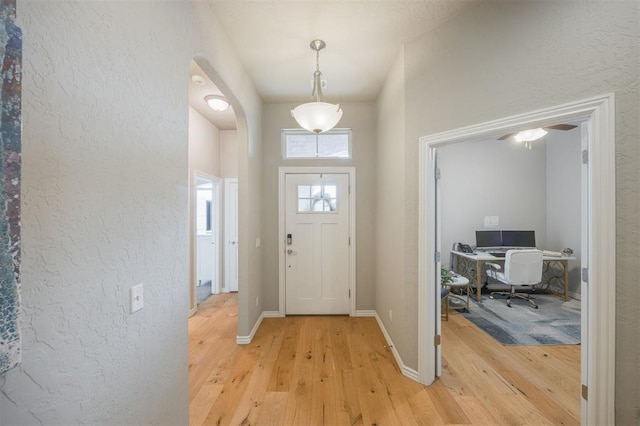 6301 Oxnard St, Edmond, OK 73034 - entrance foyer with light wood-type flooring and a textured wall
