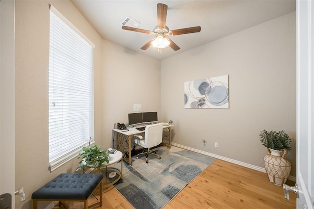 6301 Oxnard St, Edmond, OK 73034 - home office with wood finished floors and ceiling fan
