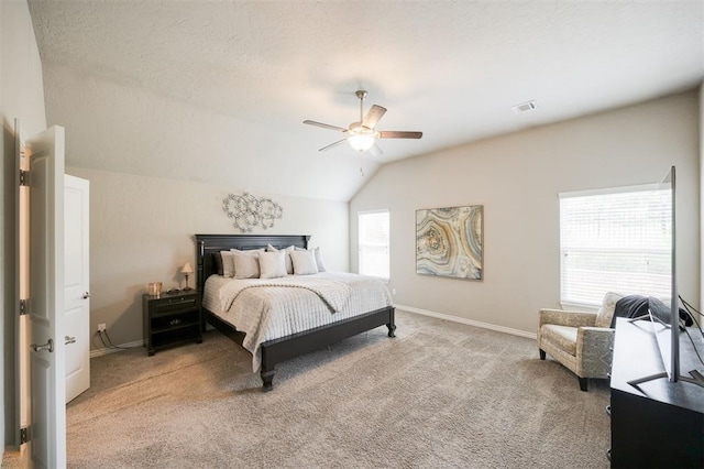 6301 Oxnard St, Edmond, OK 73034 - carpeted bedroom with vaulted ceiling, a ceiling fan, and a textured ceiling