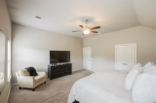 6301 Oxnard St, Edmond, OK 73034 - bedroom featuring light colored carpet, lofted ceiling, and a ceiling fan