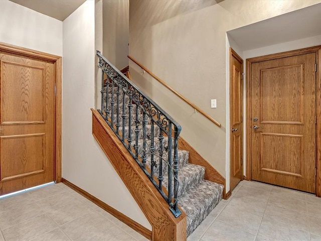4109 Riva Ridge Ct, Edmond, OK 73003 - entryway featuring light tile patterned floors and stairway