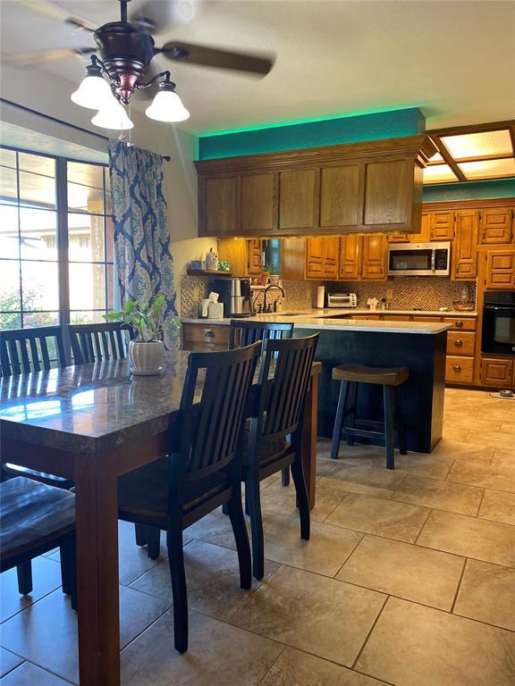 513 9th Street Cir, Hydro, OK 73048 - dining room featuring ceiling fan
