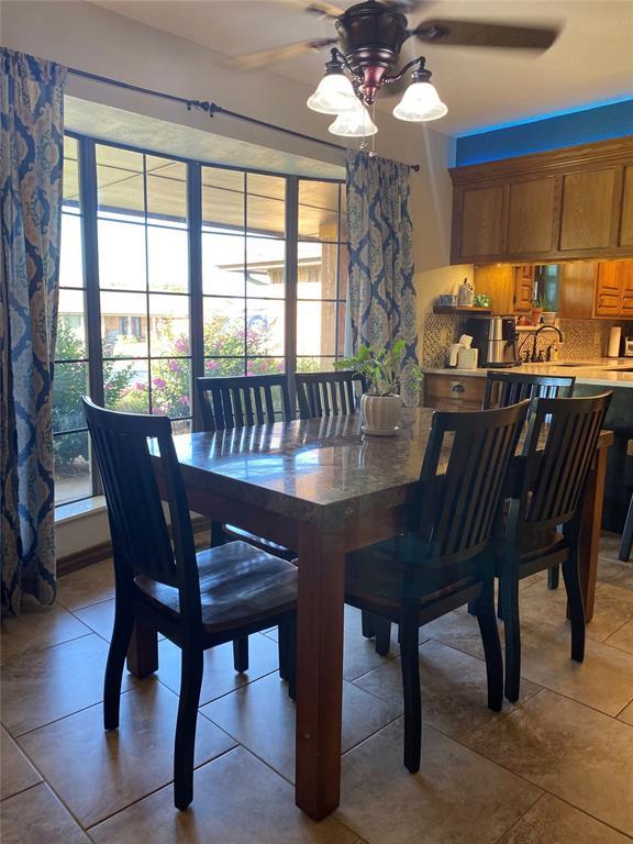 513 9th Street Cir, Hydro, OK 73048 - dining space with ceiling fan, plenty of natural light, and light tile patterned floors