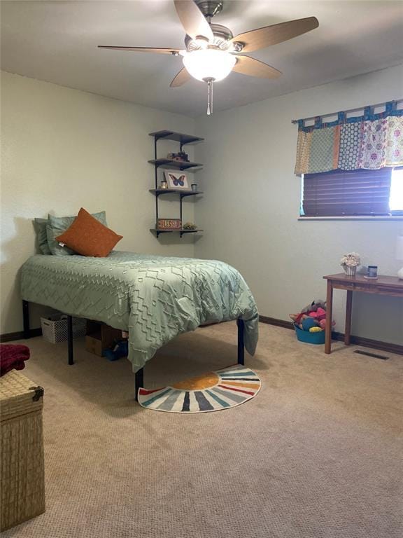513 9th Street Cir, Hydro, OK 73048 - carpeted bedroom featuring ceiling fan and baseboards