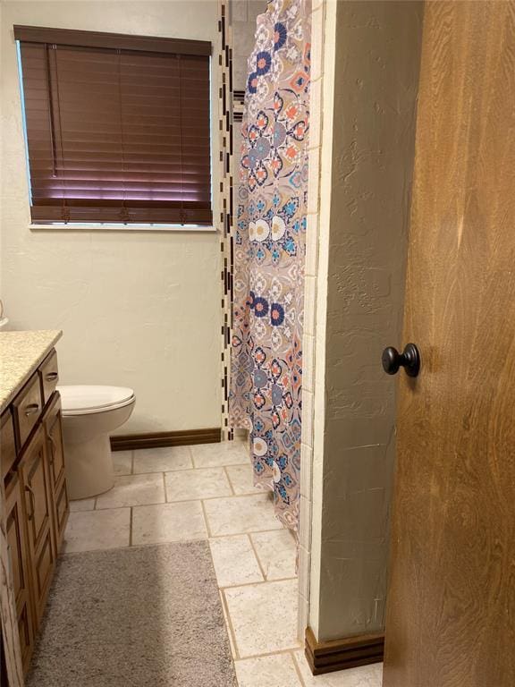 513 9th Street Cir, Hydro, OK 73048 - bathroom with vanity, stone tile flooring, and curtained shower