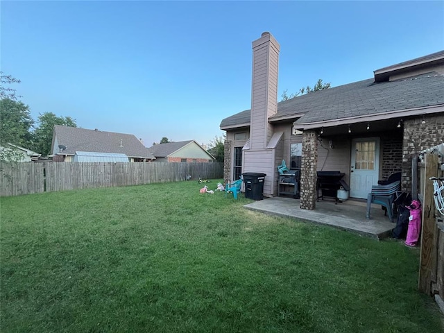 fenced backyard featuring a patio
