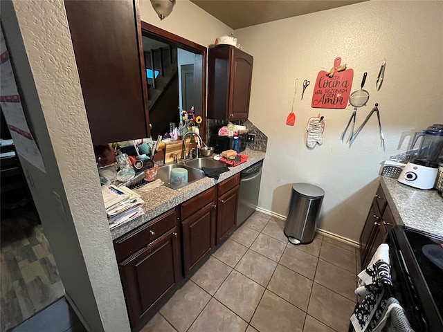 bathroom with a sink and tile patterned flooring