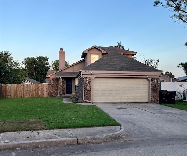 view of front of house featuring brick siding, a chimney, a garage, and concrete driveway