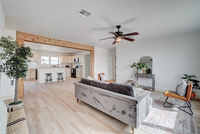 1646 County Road 1245, Tuttle, OK 73089 - living room with light wood-style flooring, ceiling fan, and recessed lighting