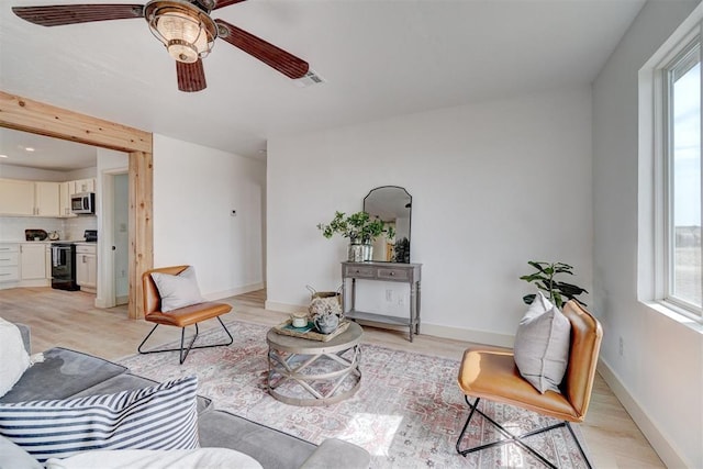 1646 County Road 1245, Tuttle, OK 73089 - living area with a ceiling fan and light wood-style flooring