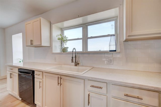 1646 County Road 1245, Tuttle, OK 73089 - kitchen featuring dishwashing machine, tasteful backsplash, light wood-style floors, and light stone counters