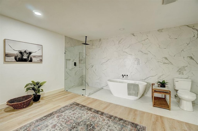 1646 County Road 1245, Tuttle, OK 73089 - full bathroom with a marble finish shower, wood finished floors, a freestanding bath, and recessed lighting