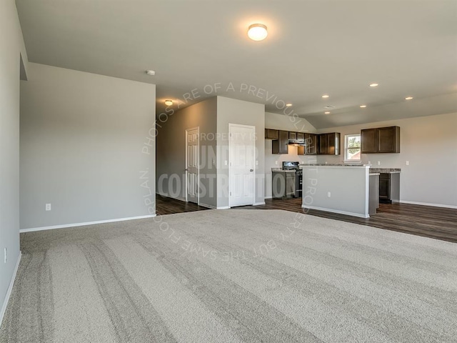 690 SW 11th St, Newcastle, OK 73065 - unfurnished living room featuring recessed lighting, dark colored carpet, and vaulted ceiling