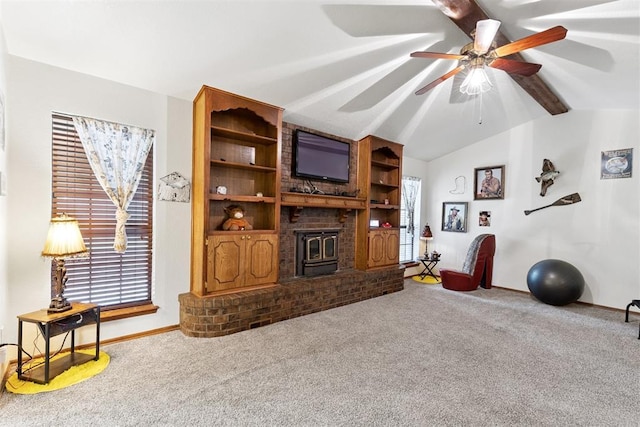 410 E Johnson St, Lexington, OK 73051 - living area featuring a wood stove, carpet flooring, and ceiling fan