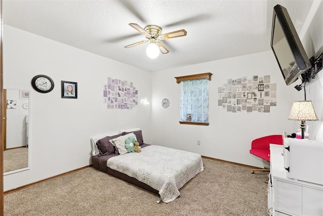 410 E Johnson St, Lexington, OK 73051 - carpeted bedroom with a textured ceiling and ceiling fan