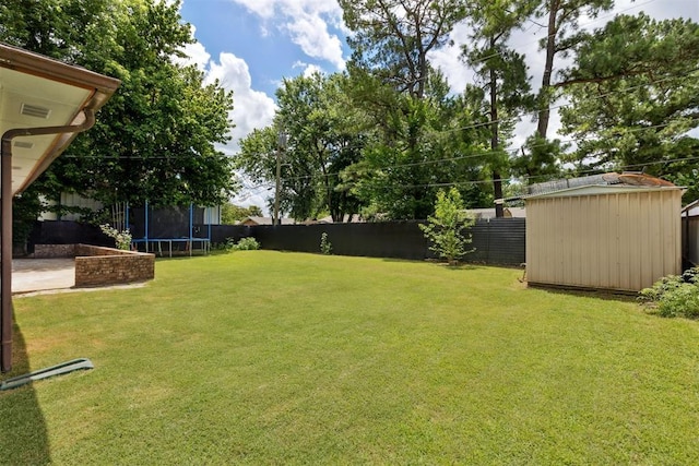 410 E Johnson St, Lexington, OK 73051 - fenced backyard with a trampoline and a storage shed