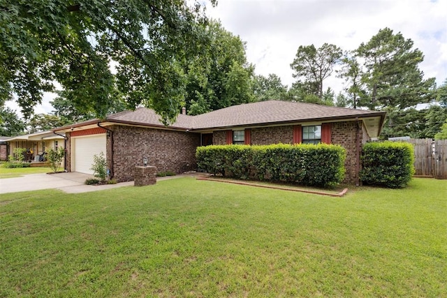410 E Johnson St, Lexington, OK 73051 - single story home with an attached garage, brick siding, and concrete driveway