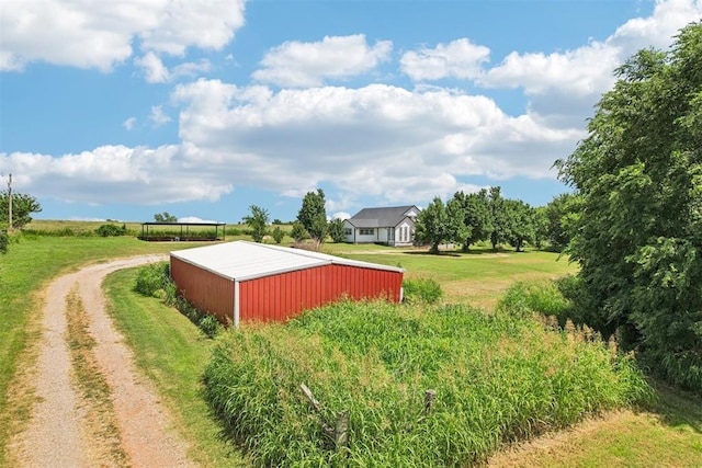 1600 Silver Stone Rd, Blanchard, OK 73010 - view of yard featuring a pole building, an outbuilding, and dirt driveway