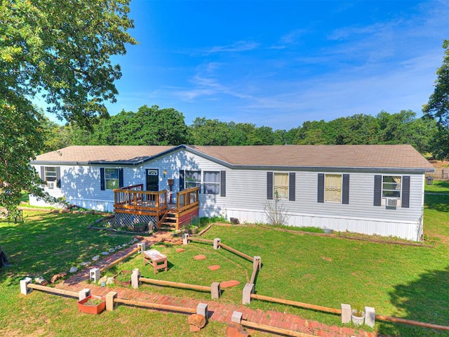 106411 Happy Trails Rd, Mcloud, OK 74851 - manufactured / mobile home featuring a deck, a front yard, and cooling unit