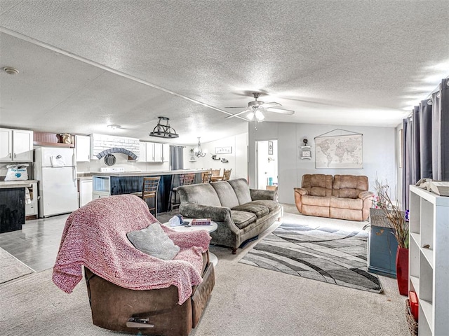 106411 Happy Trails Rd, Mcloud, OK 74851 - living room with ceiling fan, a textured ceiling, vaulted ceiling, and light carpet