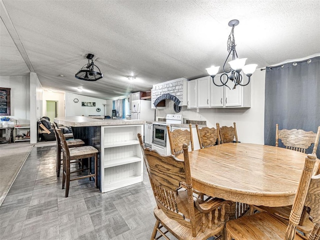 106411 Happy Trails Rd, Mcloud, OK 74851 - dining space with a chandelier and a textured ceiling