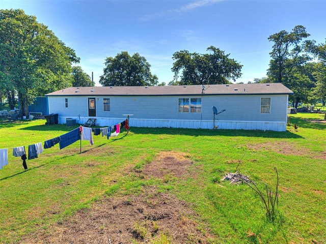 106411 Happy Trails Rd, Mcloud, OK 74851 - rear view of house featuring a lawn