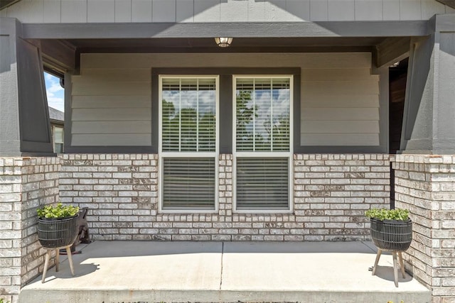 8705 Gibbs Dr, Oklahoma City, OK 73135 - doorway to property featuring a porch