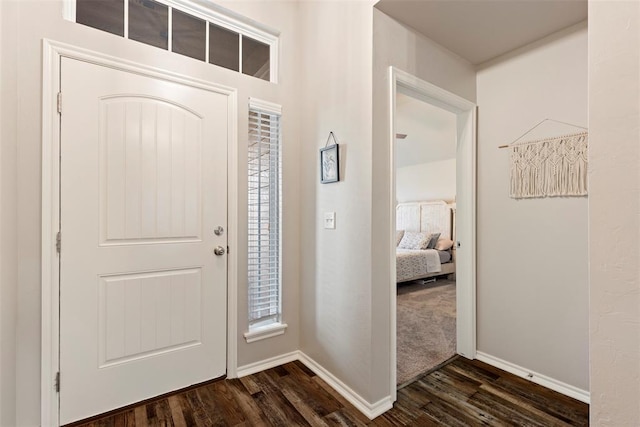 8705 Gibbs Dr, Oklahoma City, OK 73135 - foyer featuring dark wood-type flooring and baseboards