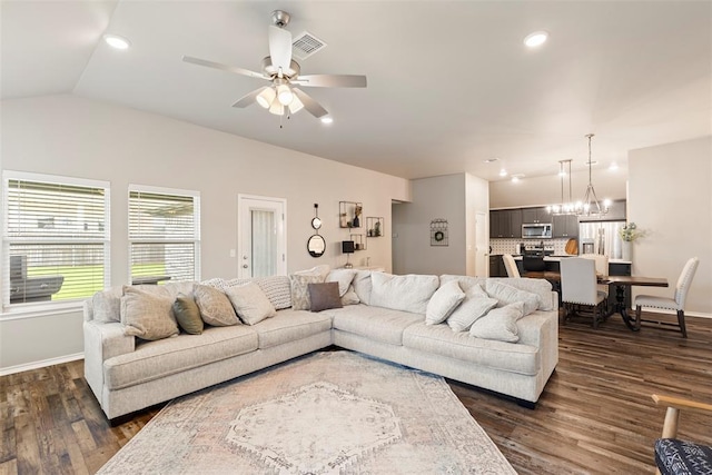 8705 Gibbs Dr, Oklahoma City, OK 73135 - living room featuring recessed lighting, dark wood-type flooring, ceiling fan, vaulted ceiling, and a chandelier