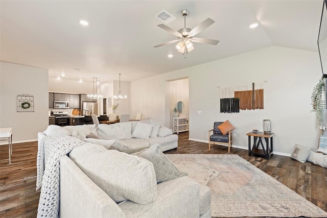 8705 Gibbs Dr, Oklahoma City, OK 73135 - living area featuring a ceiling fan, dark wood finished floors, vaulted ceiling, a chandelier, and recessed lighting