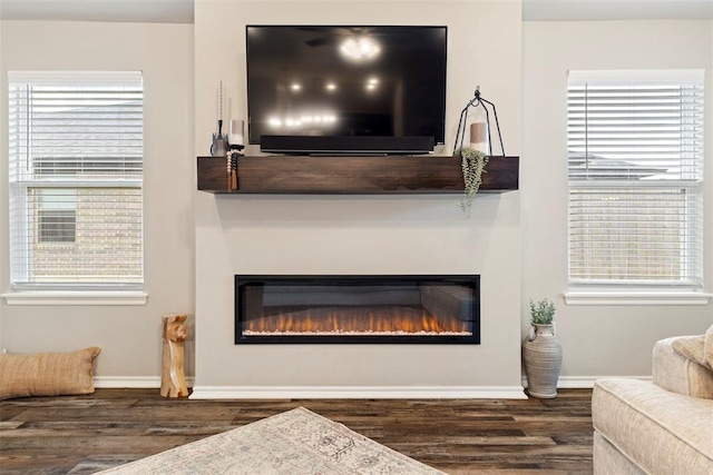8705 Gibbs Dr, Oklahoma City, OK 73135 - detailed view of a glass covered fireplace and wood finished floors