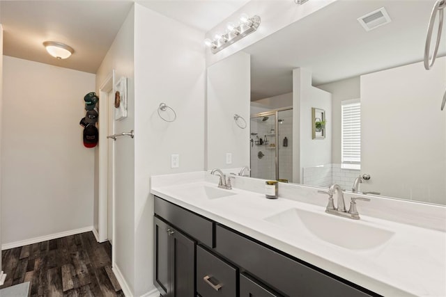 8705 Gibbs Dr, Oklahoma City, OK 73135 - full bath with a shower stall, double vanity, and wood finished floors