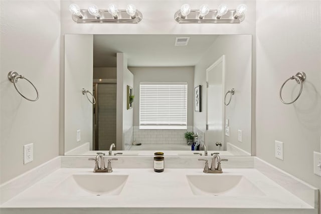 8705 Gibbs Dr, Oklahoma City, OK 73135 - full bathroom featuring double vanity, a shower with shower door, and a bath