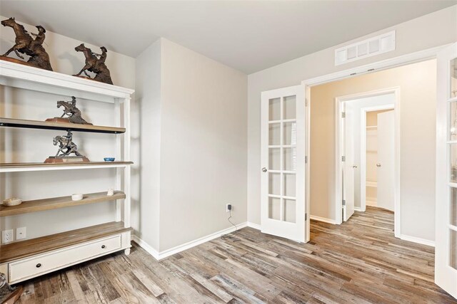 8705 Gibbs Dr, Oklahoma City, OK 73135 - unfurnished room featuring french doors and wood finished floors