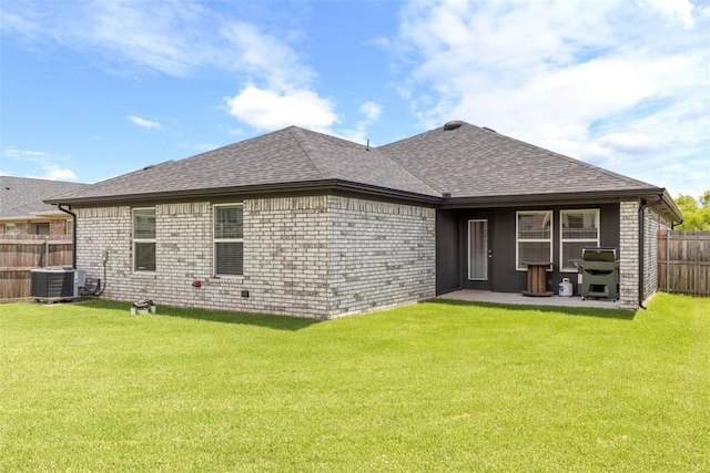 8705 Gibbs Dr, Oklahoma City, OK 73135 - rear view of house with a fenced backyard, a shingled roof, a patio area, and brick siding