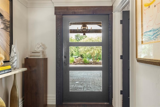 2800 E 15th St, Edmond, OK 73013 - doorway to outside featuring crown molding