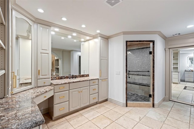 2800 E 15th St, Edmond, OK 73013 - bathroom featuring vanity, a shower stall, recessed lighting, a closet, and crown molding