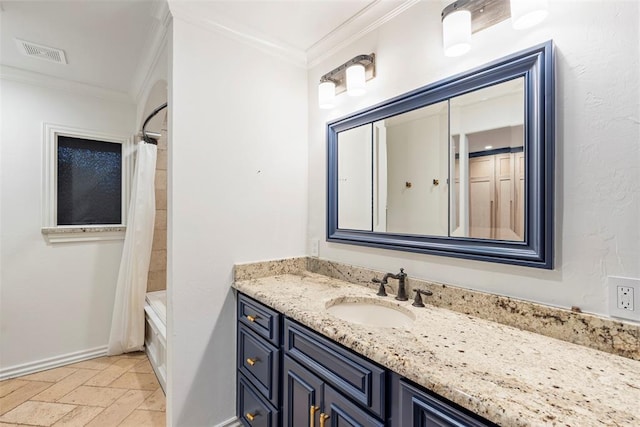 2800 E 15th St, Edmond, OK 73013 - full bath with vanity, crown molding, shower / tub combo with curtain, and stone tile flooring