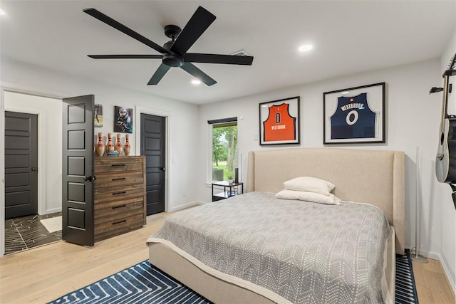 2800 E 15th St, Edmond, OK 73013 - bedroom with light wood-style flooring, recessed lighting, and a ceiling fan